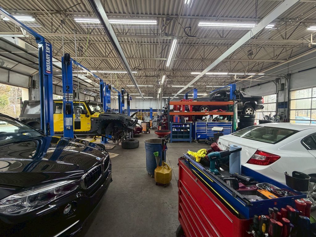Garage service bays with vehicle lifts at Grand Tires in Duluth