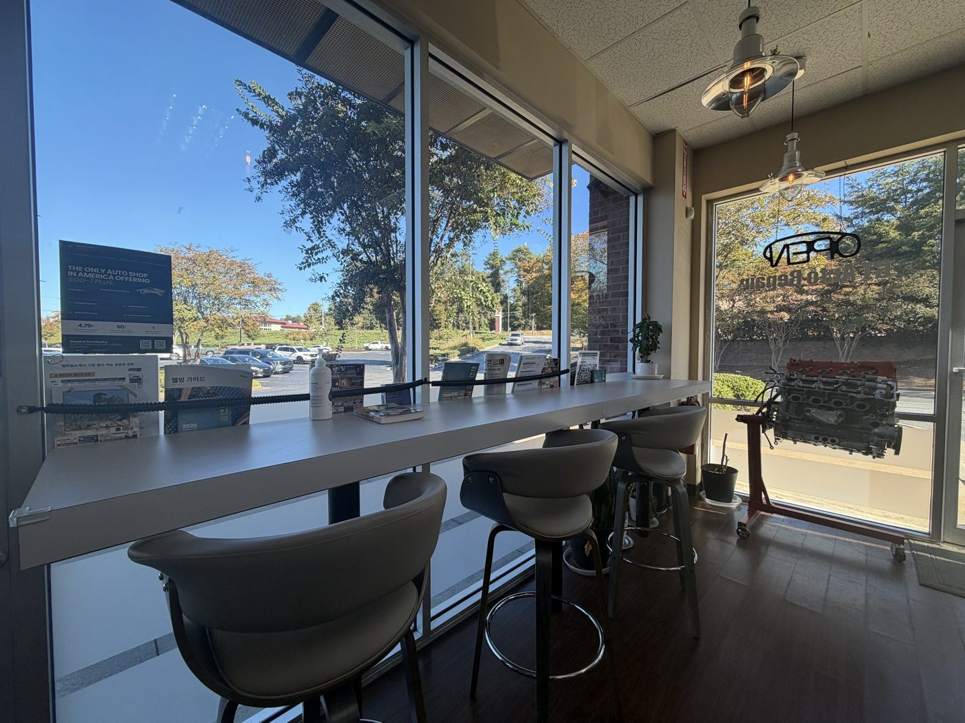 Window counter seating with reading material and an engine on display